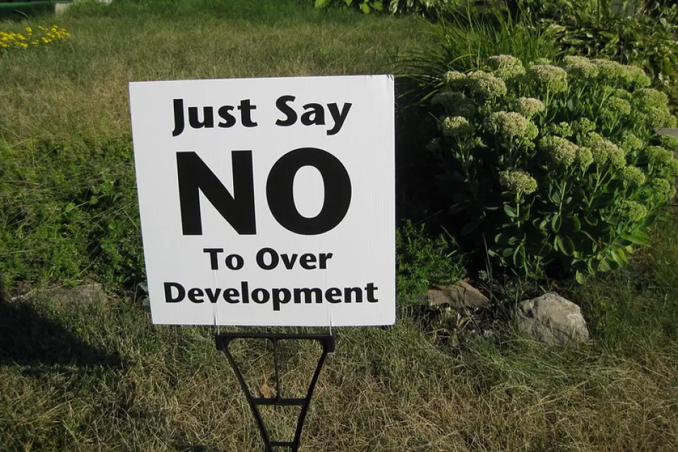 Clse-up of "Just Say No To Over Development" yard sign on green lawn